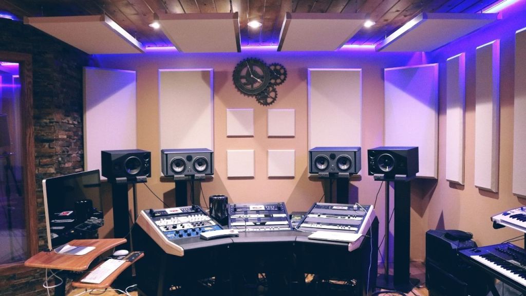 Professional music production studio with modern DAW setup and monitors.